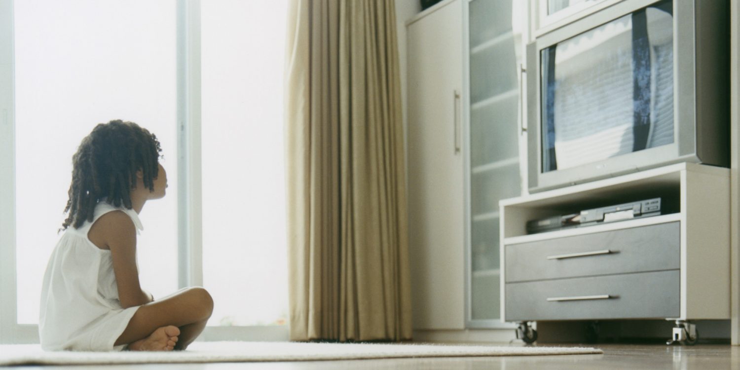 kid watching marketing video on television