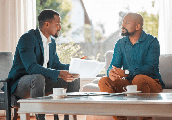 business owner talking to client to improve customer satisfaction free image