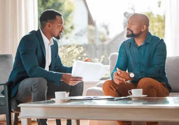 business owner talking to client to improve customer satisfaction free image