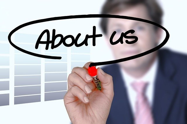 business man writing brand story on glass with marker